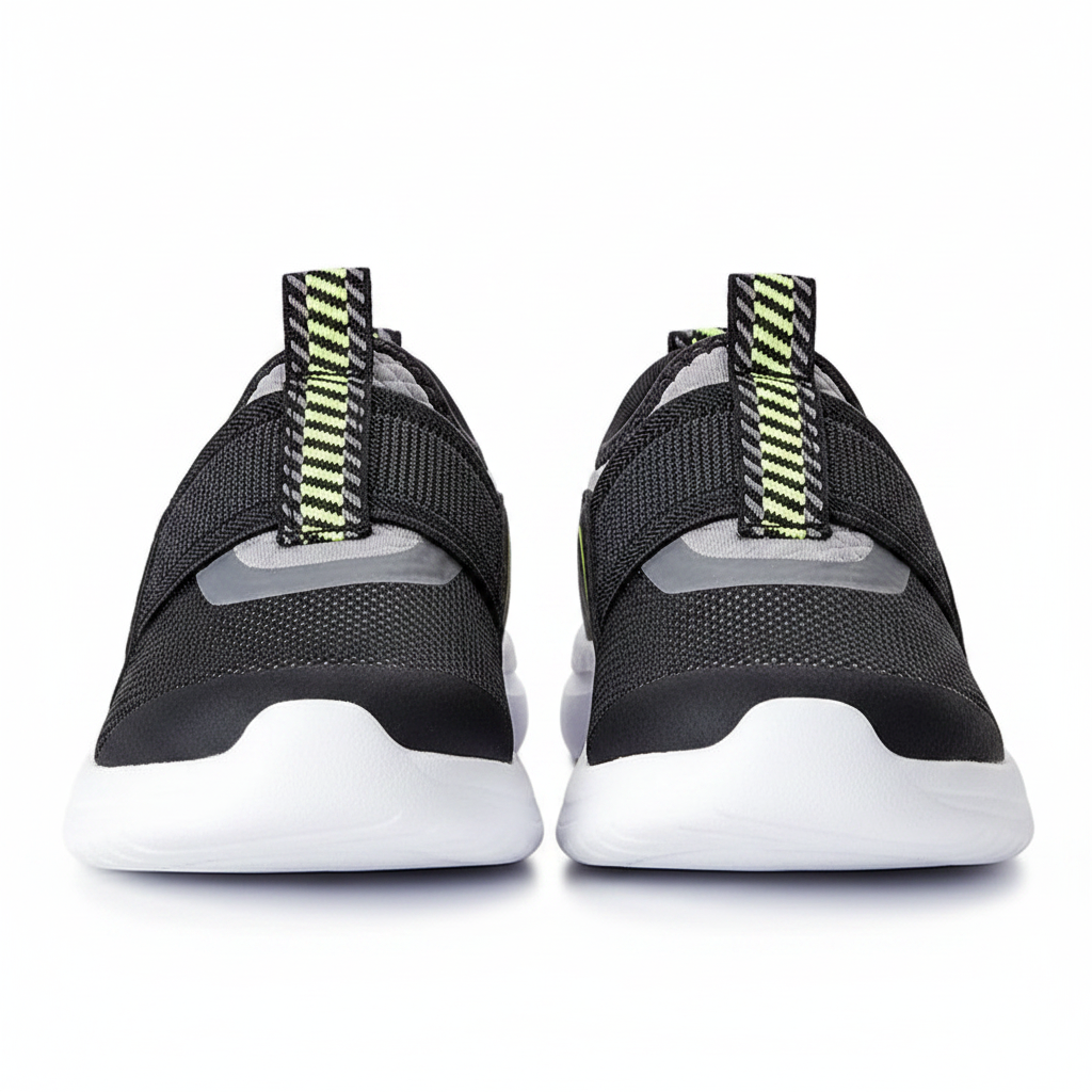 Pair of kids black slip-on athletic sneakers side by side on clean white background