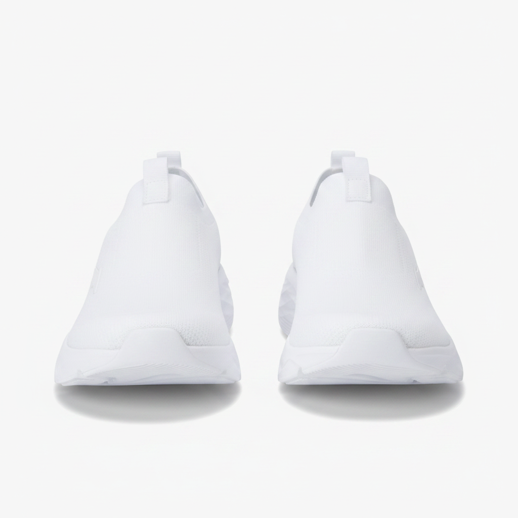Pair of women's all-white slip-on sneakers side by side on clean white background