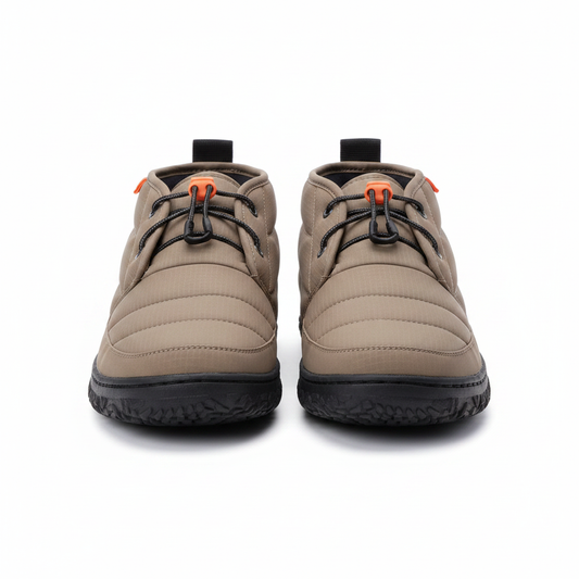 Pair of taupe quilted puffer chukka boots side by side on clean white background