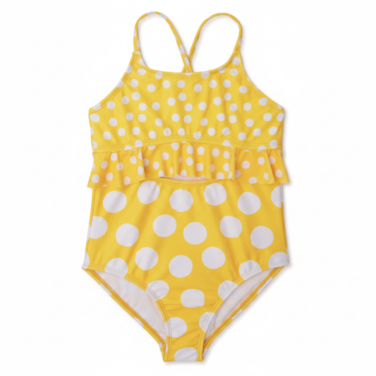 Girls bright yellow polka dot one-piece swimsuit with double ruffle peplum and cross-back straps on clean white background