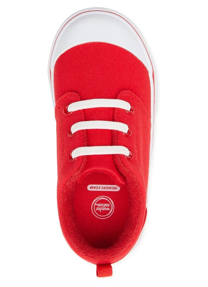 Red sneaker with white laces on a white background